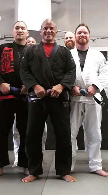 hayward jiu jitsu owner Al standing with his students